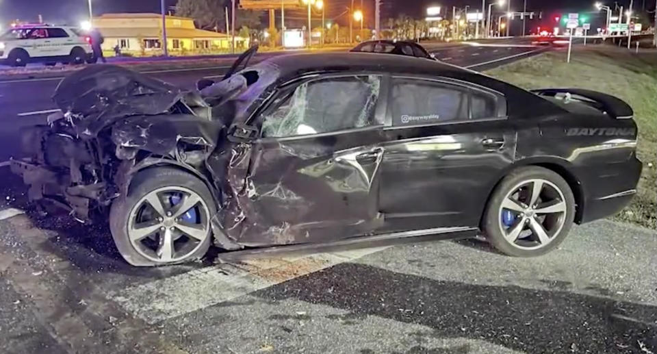 A smashed Dodge Charger is pictured.