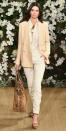 <p>Jenner looked office-ready at RL in an off-white blazer, button-up blouse, and slacks.</p>