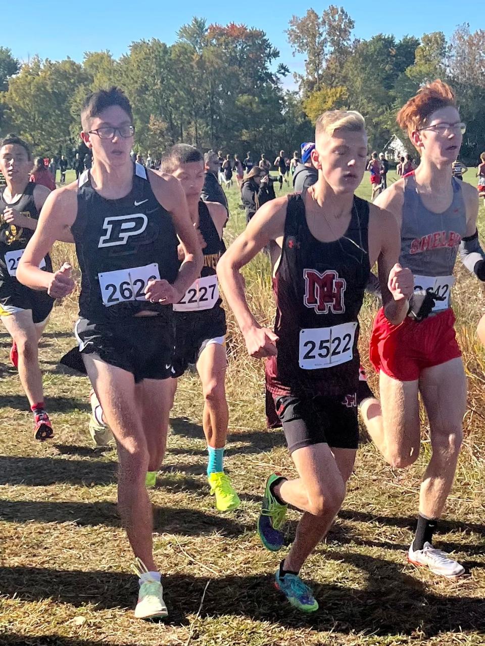 Pleasant's Will Lichtenberger and Marion Harding's Kade Sutherland run together during the Marion Harding Cross Country Invitational earlier this season. The two from Marion County placed in the top seven to gain first-team honors at the Mid Ohio Athletic Conference Meet on Saturday in Galion.