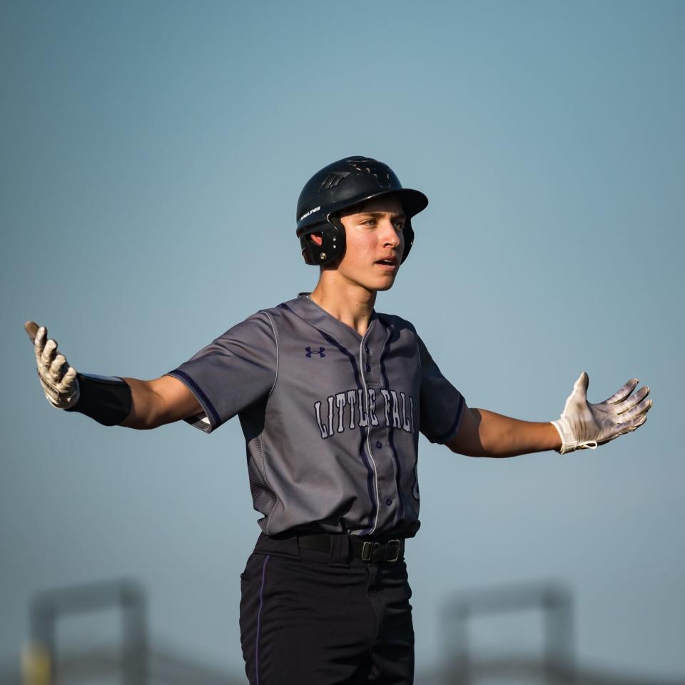 Little Falls' Jack Morotti pumps his team up on third base during the finals of the 2023 Section III Class C Baseball Tournament at Onondaga Community College on Tuesday, May 30, 2023.