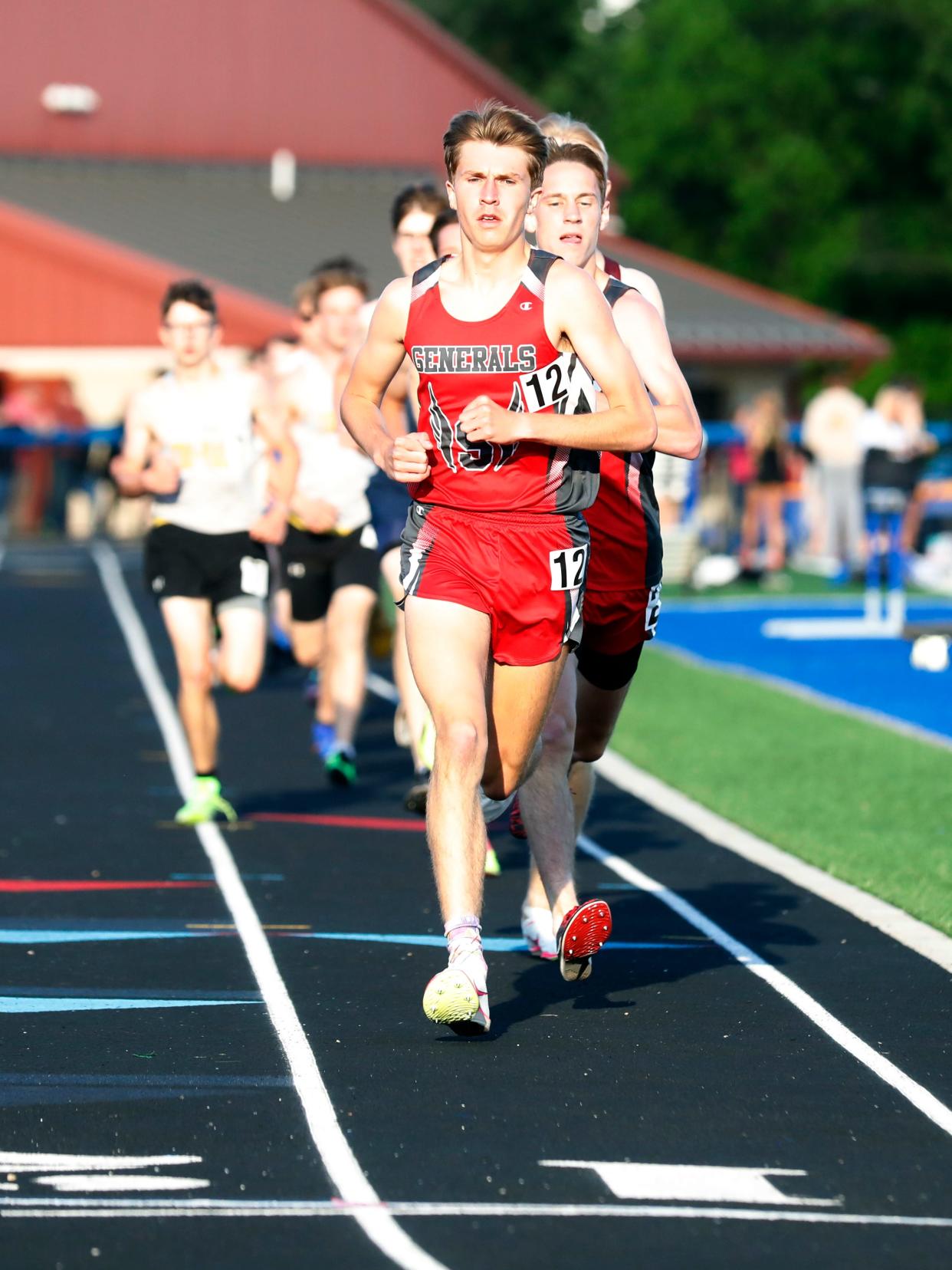 Sheridan's Tate Ruthers, left, and Simon Conrad lead the pack in the 1600 meters during the Musknigum Valley League Track and Field Meet on Friday at Maysville HIgh School.