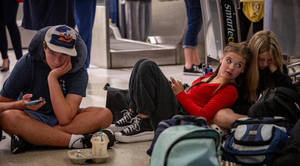 Miami, Florida - June 20, 2023 - Stranded Middle School students pass away the time on their phones at MIA . A group of Middle school students from Reno, Nevada missed their connection to Costa Rica last night after their flight to Miami was diverted to Tampa due to thunderstorms.