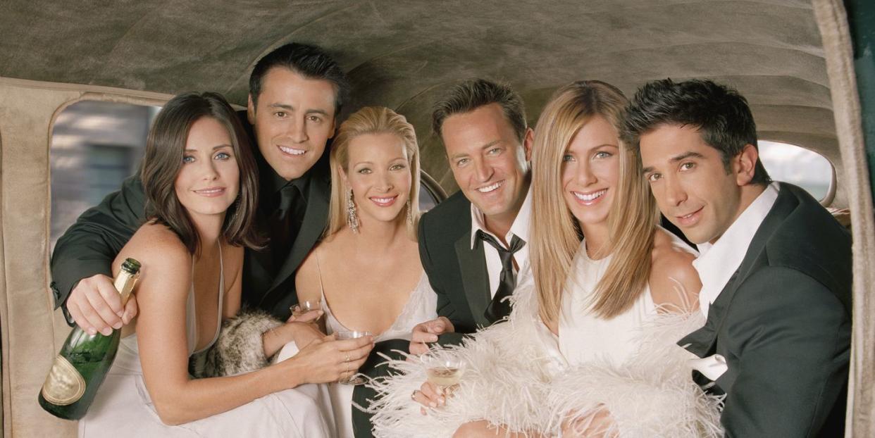 the cast of friends all pictured together in the back of a limo