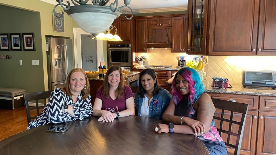 Rachel Vindman, left, before a kitchen table podcast recording with Kathy, Sugitha and Ebonei in Rochester Hills, Michigan.