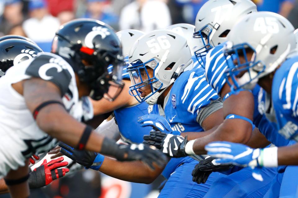 Memphis Tigers offensive lineman Dylan Parham (56) blocks against the Cincinnati defensive line during the AAC Championship game at the Liberty Bowl Memorial Stadium on Saturday, Dec. 7, 2019. 