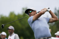 Rickie Fowler watches his tee shot on the second hole during the first round of the Wells Fargo Championship golf tournament at the Quail Hollow Club Thursday, May 9, 2024, in Charlotte, N.C. (AP Photo/Erik Verduzco)