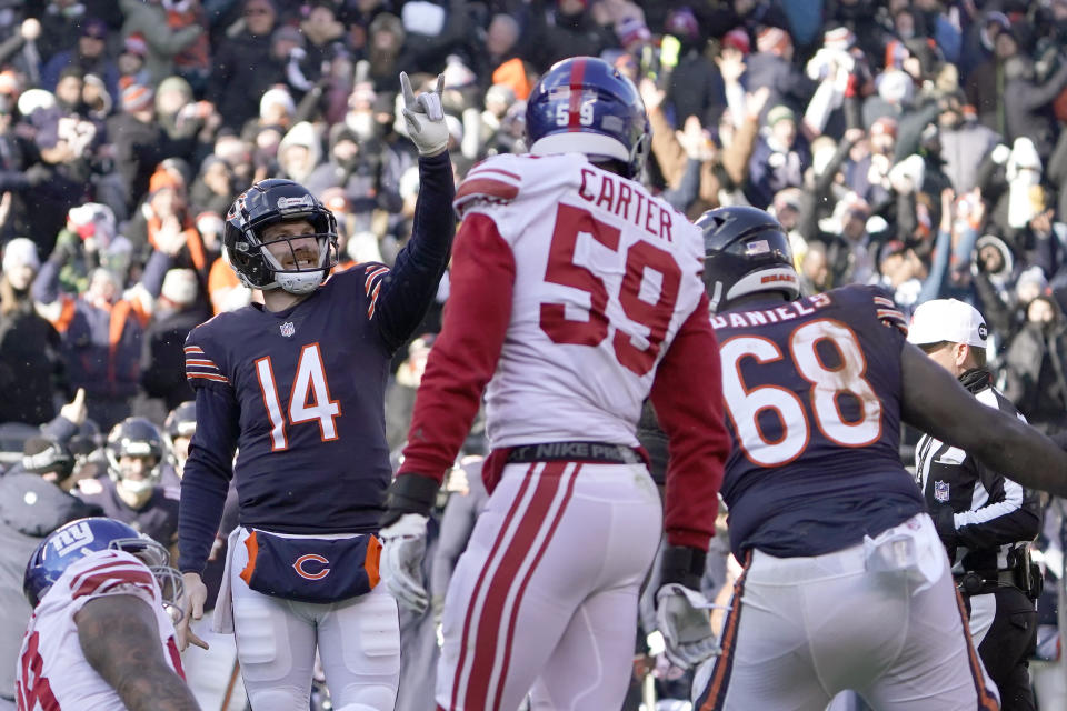 Chicago Bears quarterback Andy Dalton (14) celebrates his touchdown pass to wide receiver Darnell Mooney during the first half of an NFL football game against the New York Giants Sunday, Jan. 2, 2022, in Chicago. (AP Photo/David Banks)