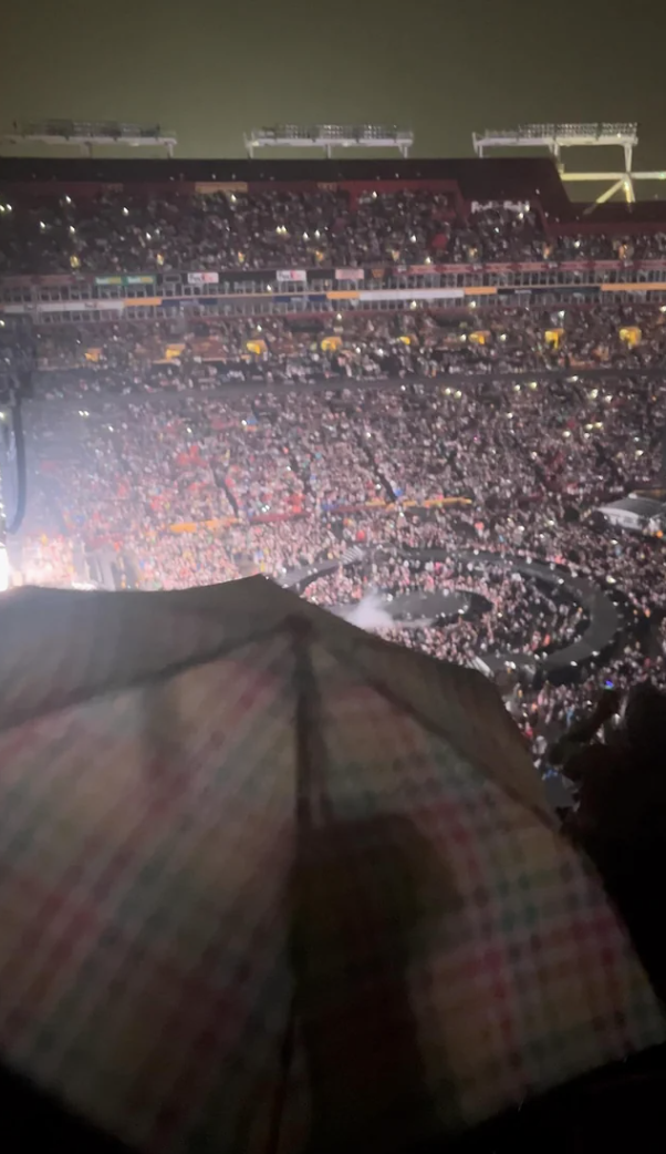 umbrella blocking the view of the stage