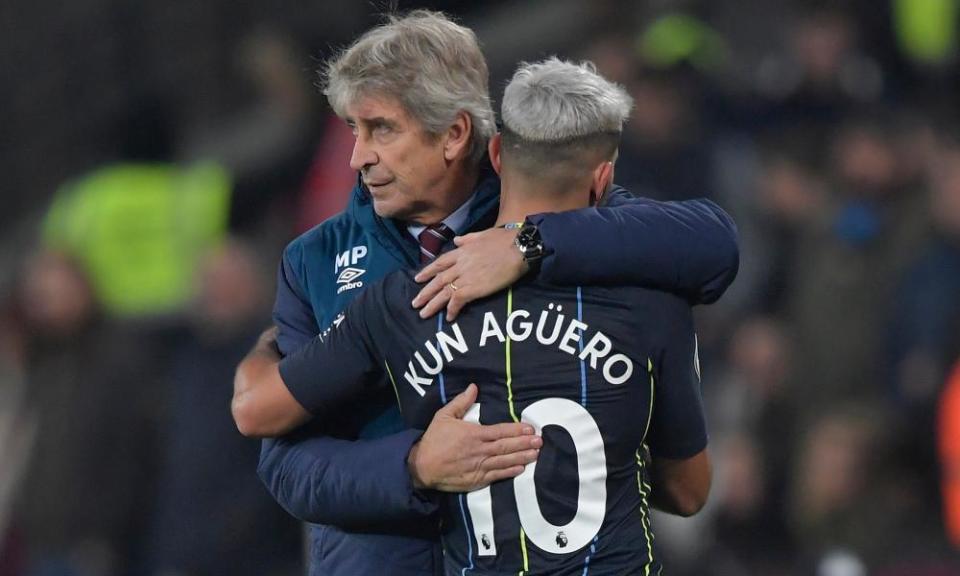 Sergio Agüero hugs his former manager, Manuel Pellegrini, after coming off for Manchester City.