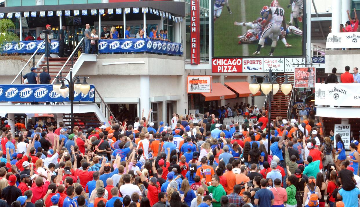 2013: Florida-Georgia gameday fandom stretched beyond the stadium and into the streets of downtown. A wave of orange, blue, black and red overtook the Jacksonville Landing as fans gathered to watch the game and enjoy what has been termed "The World's Largest Outdoor Cocktail Party."
