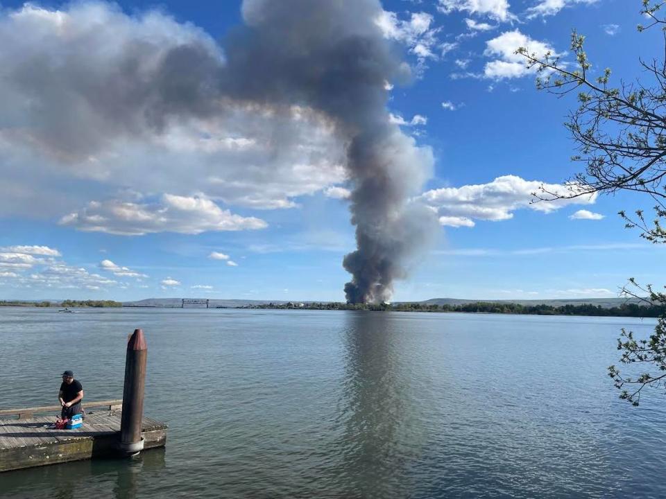 The plume of smoke from the Lineage Logistics warehouse fire in Finley as seen across the Columbia River at Sacajawea State Park about 4 p.m. Sunday.
