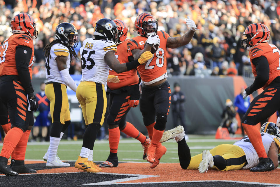 Cincinnati Bengals running back Joe Mixon (28) reacts after scoring a touchdown against the Pittsburgh Steelers during the second half of an NFL football game, Sunday, Nov. 28, 2021, in Cincinnati. (AP Photo/Aaron Doster)