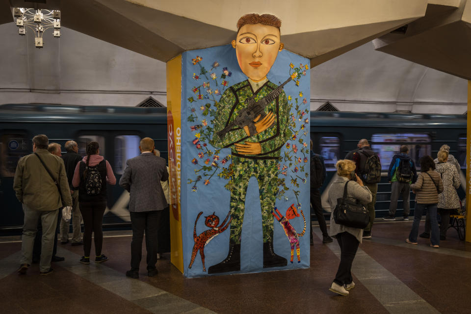 Commuters take the subway in Kharkiv, eastern Ukraine, Tuesday, May 24, 2022. Kharkiv subway resumed service on Tuesday morning after it was closed for more than two months during Russian attempt to capture the city. (AP Photo/Bernat Armangue)