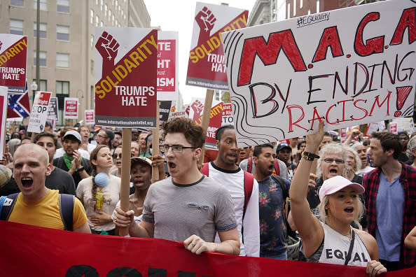 Counter-protesters chant and hold signs during the Unite the Right 2 rally in Washington, D.C., U.S., on Sunday, Aug. 12, 2018. The rally marks the one-year anniversary of the Charlottesville, Virginia, rally where a car driven into a crowd of counter protesters killed 32-year-old Heather Heyer. Photographer: Aaron P. Bernstein/Bloomberg