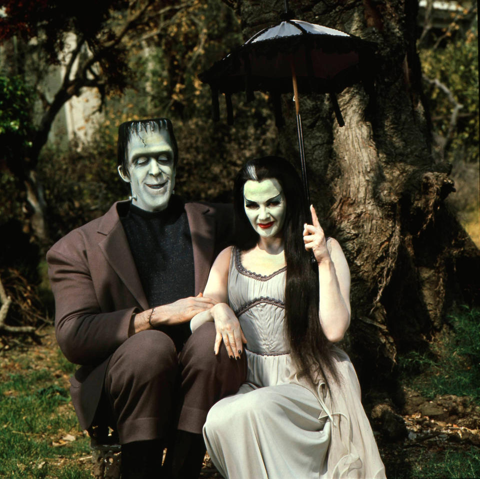 Herman Munster and wife Lily enjoy some time in a dark forest