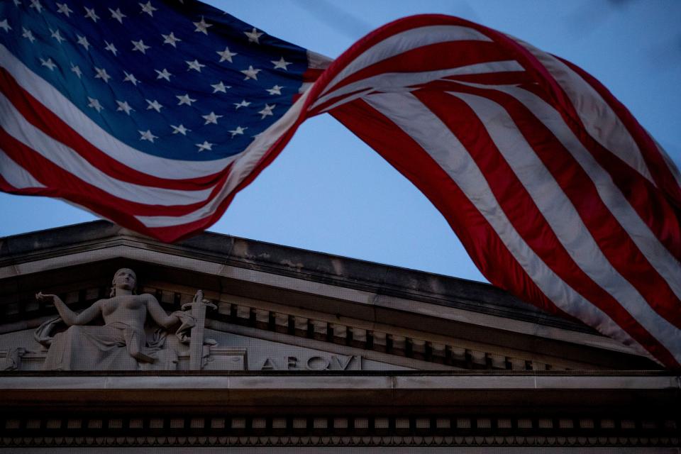 An American flag flies outside the Department of Justice in Washington on March 22, 2019.