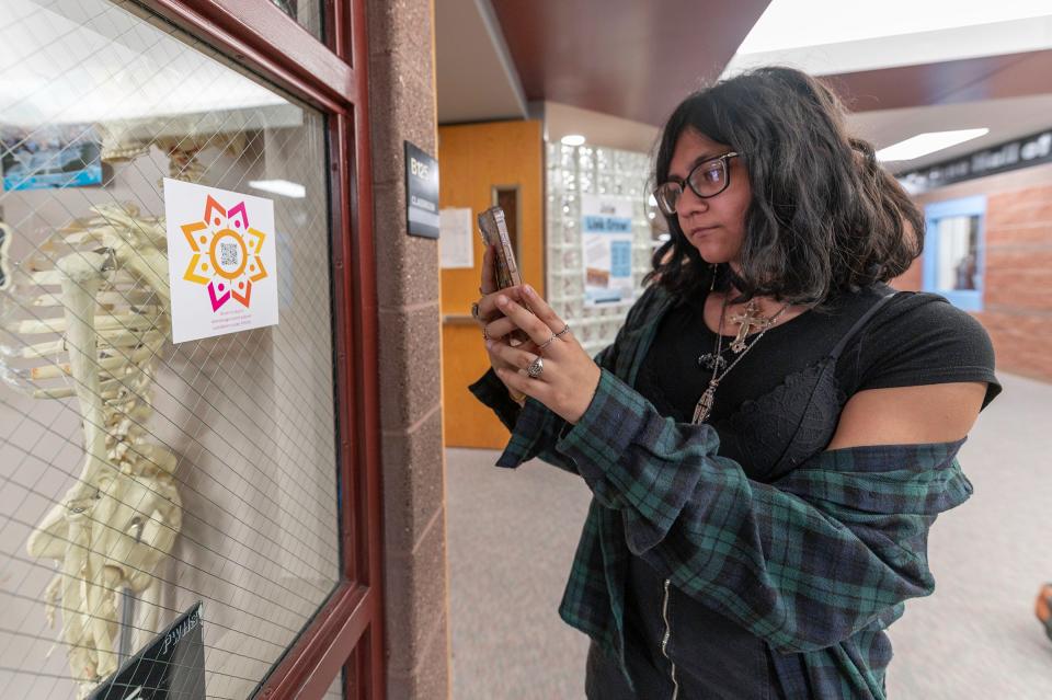 Riya Singh scans a SoCoYoGo QR code at Pueblo West High School on Wednesday, March 20, 2024.