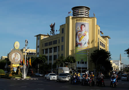 Photos of King Maha Vajiralongkorn are seen along a street during his coronation in Bangkok, Thailand, May 4, 2019. REUTERS/Jorge Silva