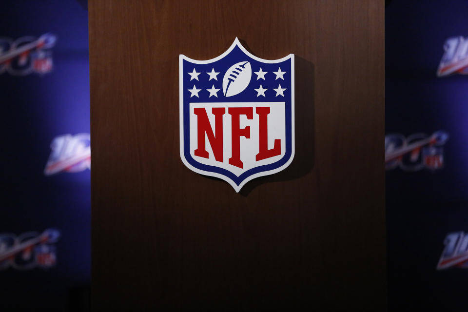 FILE - In this Wednesday, May 22, 2019, file photo, the NFL logo is seen during the NFL football owners meeting in Key Biscayne, Fla. The NFL is partnering with three non-profit, non-partisan organizations to get out the vote as the league leverages its “Inspire Change” initiative. The program will support and encourage voting and civic engagement efforts of current and former NFL players, club and league personnel and fans beginning Friday, Aug. 7, 2020, until Election Day in November. (AP Photo/Brynn Anderson, File)