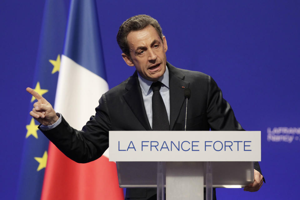 France's President and candidate for re-election in 2012, Nicolas Sarkozy, gestures as he delivers a speech during a meeting in Nancy, north-eastern France, Monday, April 2, 2012. (AP Photo/Michel Euler)
