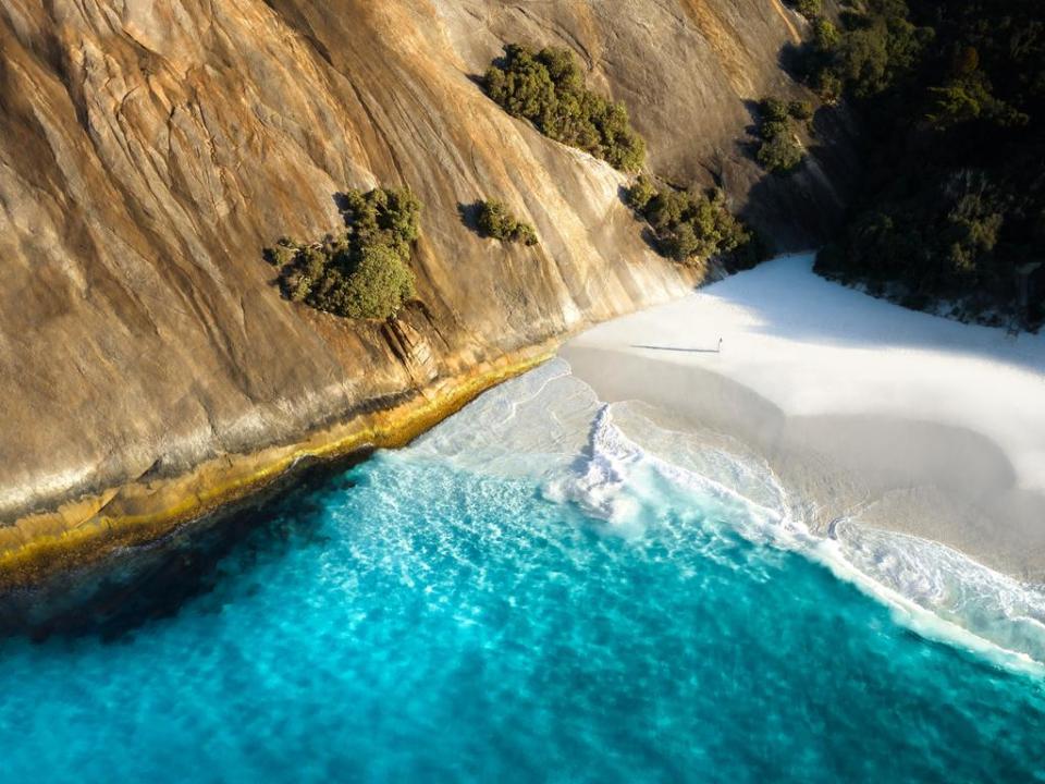 White sand, trees and clear water at Misery Beach. Source: Tourism Australia/Merr Watson