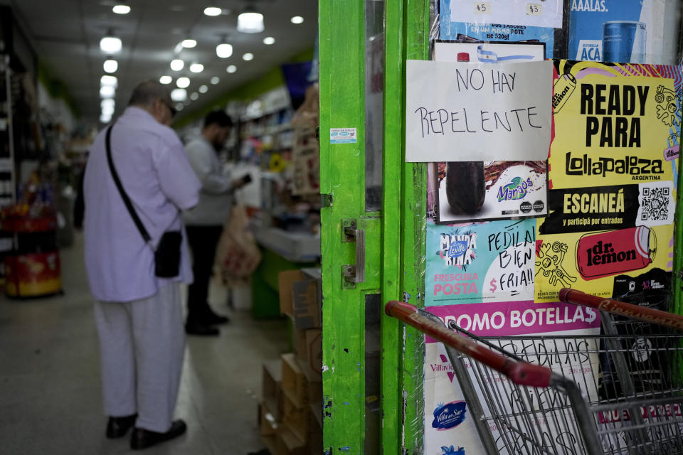 A piece of paper with a message that reads in Spanish: "There is no repellent" is taped to a storefront in Buenos Aires, Argentina, Thursday, April 4, 2024. An increase in dengue fever cases as resulted in the demand for repellents to avoid the bite of the mosquito that transmits the disease, causing a shortage and exorbitant prices where available. (AP Photo/Natacha Pisarenko)