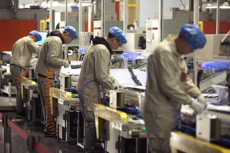 FILE - In this Friday, Feb. 24, 2017, file photo, factory workers assemble the cases of air conditioners on an assembly line at a factory in Jiaozhou, eastern China's Shandong Province. Two surveys show Chinese factory activity grew in April but below the previous month's pace amid a tariff battle with Washington. (AP Photo/Mark Schiefelbein, File)