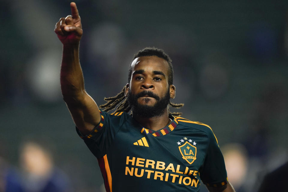 LA Galaxy defender Raheem Edwards gestures to the crowd after the team's win over Minnesota United in an MLS soccer match Wednesday, Sept. 20, 2023, in Carson, Calif. (AP Photo/Ryan Sun)