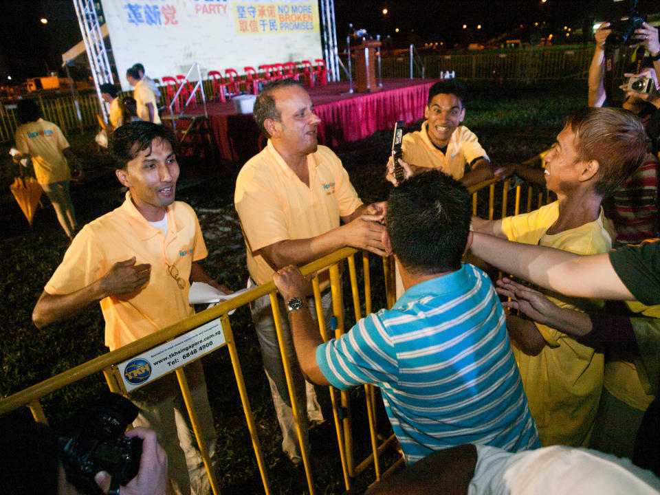 Kenneth Jeyaretnam shakes the hands of those who wish him luck in the four-corner by-election. (Yahoo! photo/Alvin Ho)