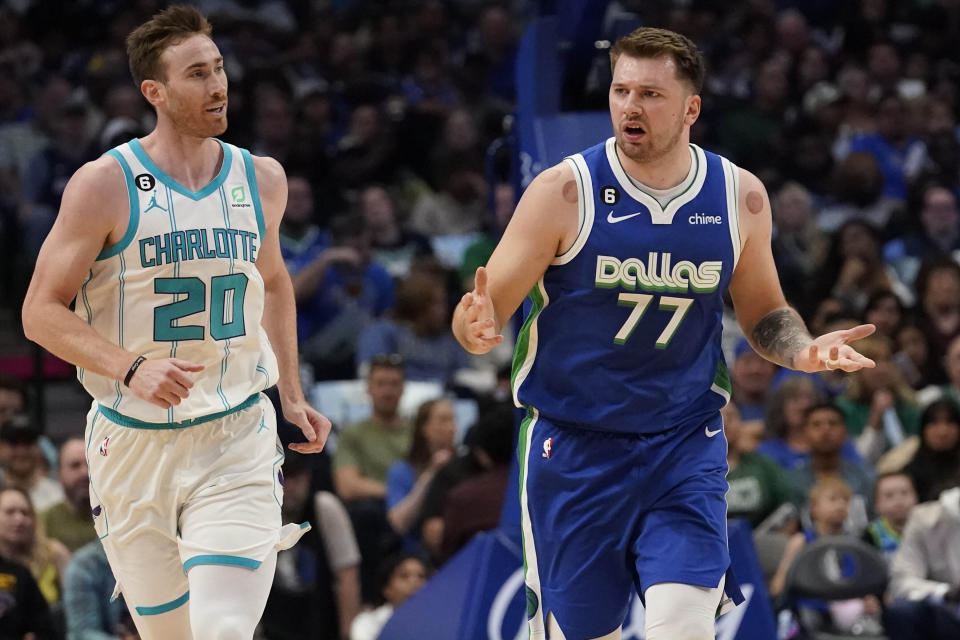 Dallas Mavericks guard Luka Doncic (77) questions a "no call" by officials against Charlotte Hornets forward Gordon Hayward (20) during the first quarter of an NBA basketball game in Dallas, Friday, March 24, 2023. (AP Photo/LM Otero)