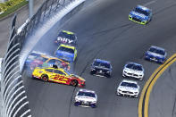 Joey Logano (22), Kyle Busch (18) and Brad Keselowski (2) collide in Turn 4 during the NASCAR Daytona Clash auto race at Daytona International Speedway, Sunday, Feb. 9, 2020, in Daytona Beach, Fla. (AP Photo/Phelan M. Ebenhack)