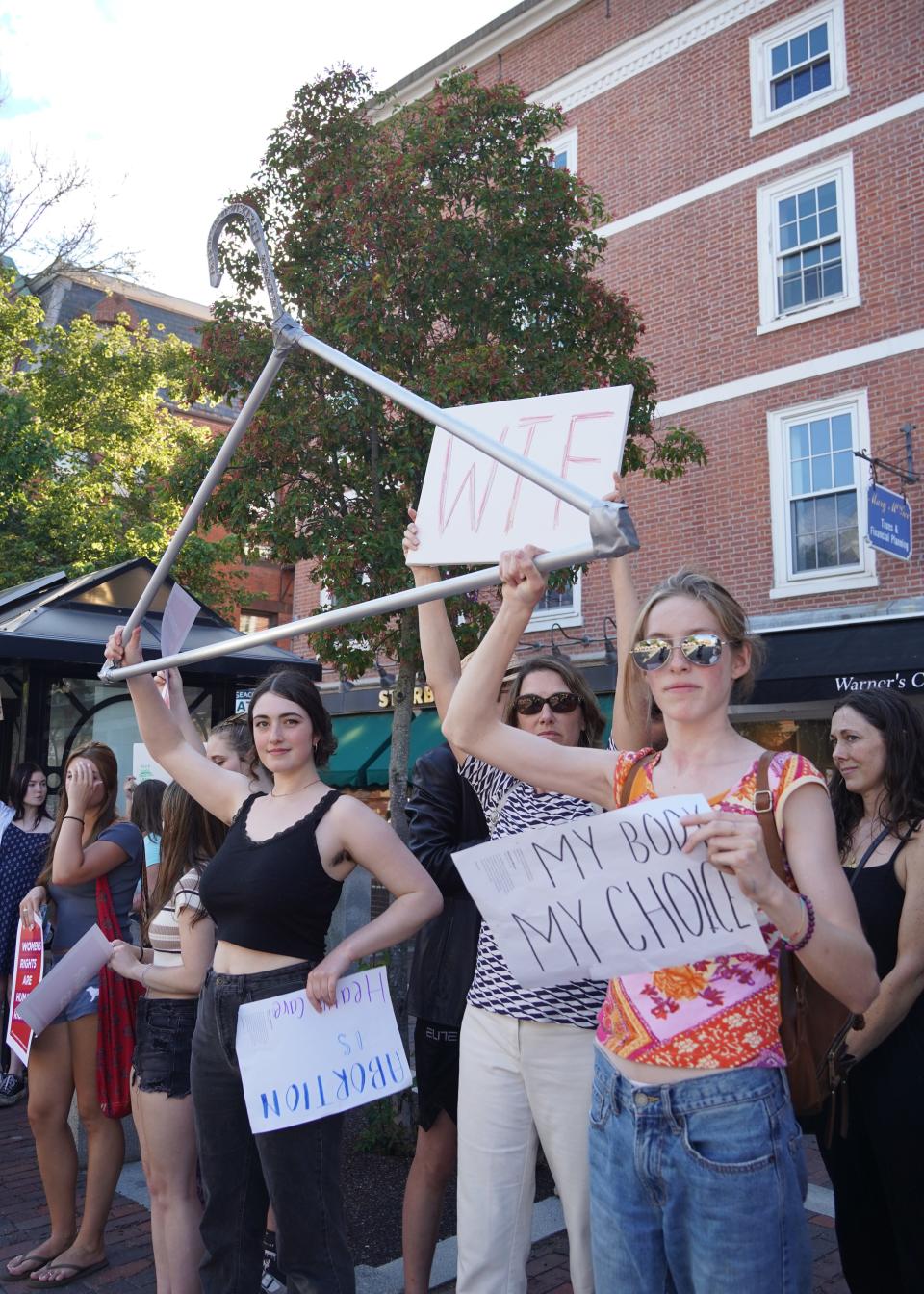 Lane Joslin, 18, right, with their mother Barbara MacLeod during the "Bans Off Our Bodies" rally in Market Square in Portsmouth Friday, June 24, 2022.