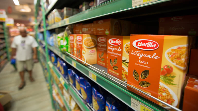 Boxes of dry Barilla pasta shelved in a store