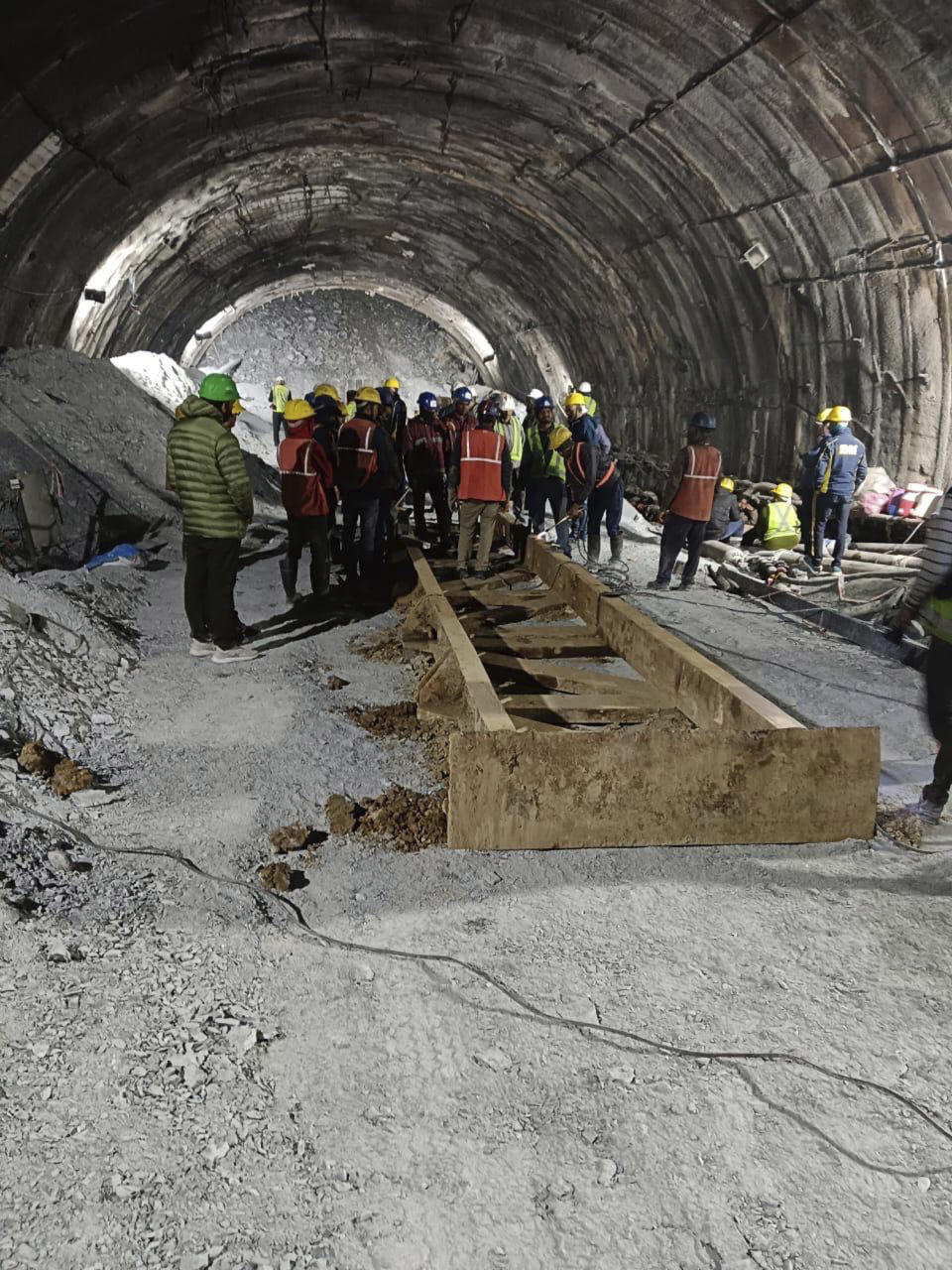 This photo provided by Uttarakhand State Disaster Response Force (SDRF) shows rescue work inside a collapsed road tunnel where 40 workers were trapped in northern in Uttarakhand state, India, Tuesday, Nov.14, 2023. ( SDRF via AP)