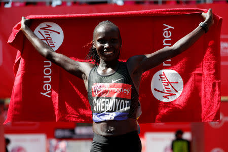 FILE PHOTO: Kenya's Vivian Cheruiyot celebrates after winning the London Marathon, Britain - April 22, 2018. REUTERS/Paul Childs/File Photo