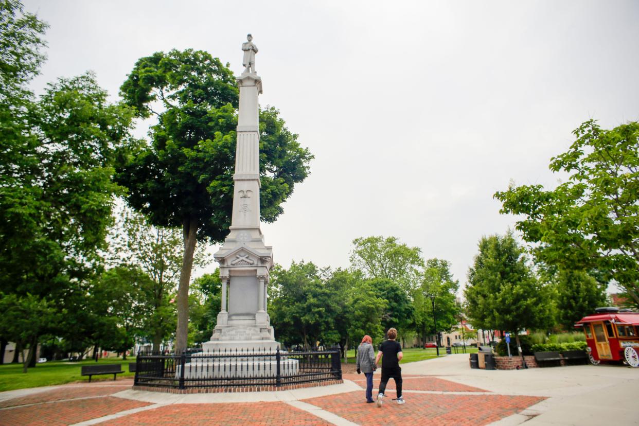 A couple walks by the Sheboygan Civil War monument, Friday, June 21, 2024, in Sheboygan, Wis.