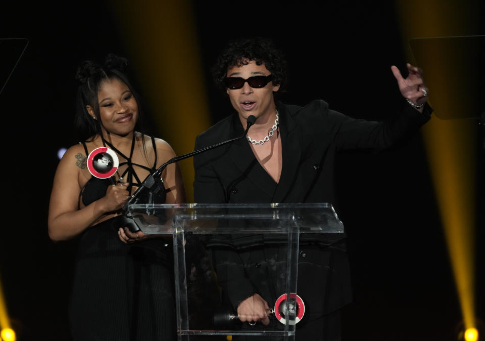 Anthony Ramos, right, and Dominique Fishback accept the Rising Stars of the Year award at the Big Screen Achievement Awards during CinemaCon, the official convention of the National Association of Theatre Owners (NATO) at Caesars Palace on Thursday, April 27, 2023, in Las Vegas. (AP Photo/Chris Pizzello)