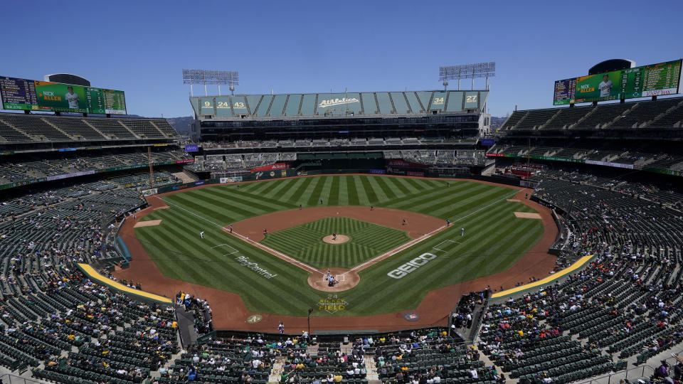 FILE - Fans at RingCentral Coliseum watch a baseball game between the Oakland Athletics and the Houston Astros in Oakland, Calif., Saturday, July 9, 2022. The A's lease at RingCentral Coliseum expires after the 2024 season, and though they might be forced to extend the terms, the club and Major League Baseball have deemed the stadium unsuitable for a professional franchise.(AP Photo/Jeff Chiu, File)