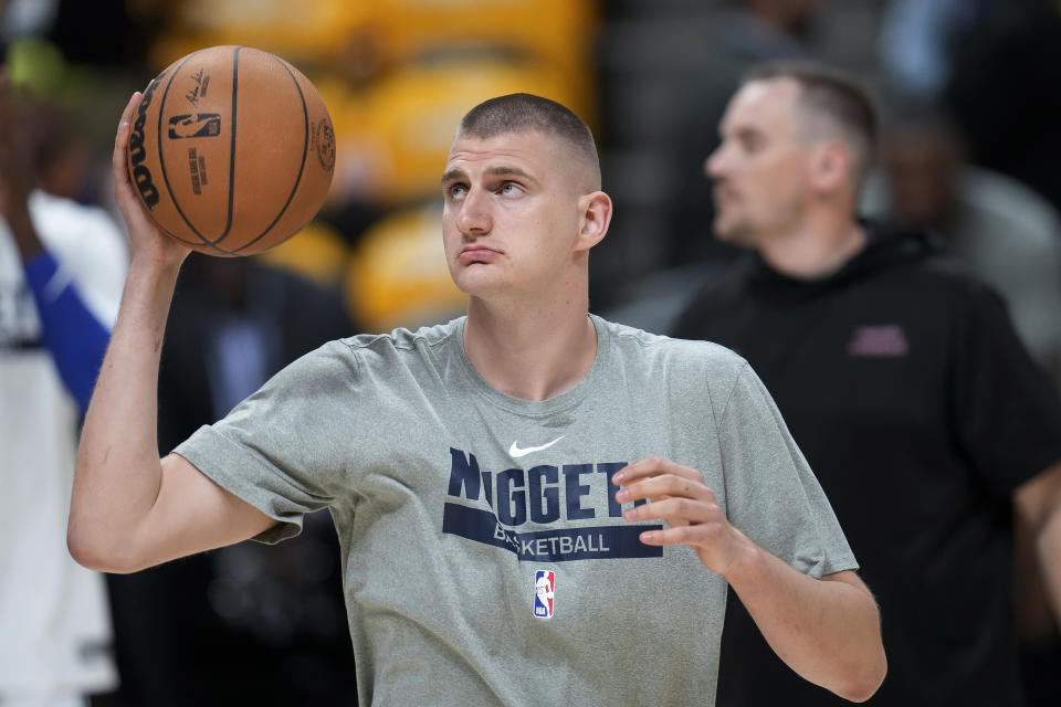 Denver Nuggets center Nikola Jokic warms up before Game 1 of the basketball team's NBA Finals against the Miami Heat, Thursday, June 1, 2023, in Denver. (AP Photo/David Zalubowski)