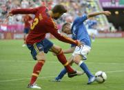 Spanish defender Gerard Pique (L) fights for the ball with Italian midfielder Emanuele Giaccherini during the Euro 2012 championships football match Spain vs Italy on June 10, 2012 at the Gdansk Arena. AFP PHOTO / PIERRE-PHILIPPE MARCOUPIERRE-PHILIPPE MARCOU/AFP/GettyImages