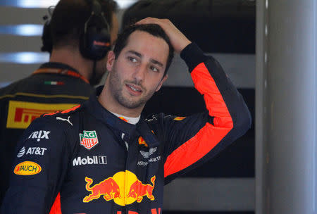 Formula One - F1 - Australian Grand Prix - Melbourne, Australia - 26/03/2017 - Red Bull Racing driver Daniel Ricciardo of Australia reacts in the team garage after retiring from the Australian Formula One Grand Prix. REUTERS/Brandon Malone