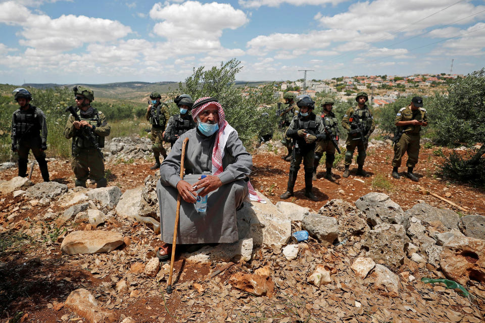 Image: A Palestinian man  (Mohamad Torokman / Reuters)