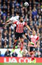 <p>Ryan Bertrand and Kyle Walker go up for a header </p>