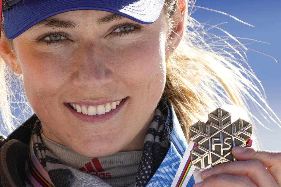 United States' Mikaela Shiffrin shows her bronze medal of the women's slalom, at the alpine ski World Championships in Cortina d'Ampezzo, Italy, Saturday, Feb. 20, 2021. (AP Photo/Giovanni Auletta)