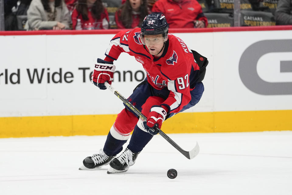 Washington Capitals center Evgeny Kuznetsov skates with the puck against the New York Rangers during the third period of an NHL hockey game, Saturday, Feb. 25, 2023, in Washington. The Capitals won 6-3. (AP Photo/Julio Cortez)