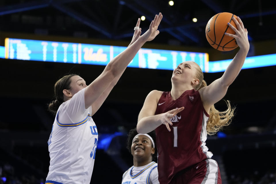 Washington State guard Tara Wallack, right, looks to shoot against UCLA forward Angela Dugalic, left, during the first half of an NCAA college basketball game, Sunday, Jan. 28, 2024, in Los Angeles. (AP Photo/Ryan Sun)