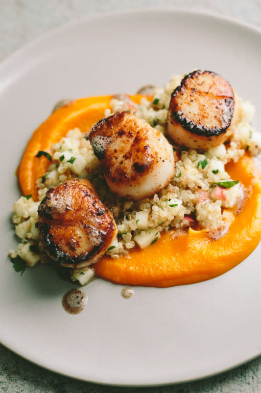 <p>A Thought for Food</p><p>When you want something fancy for date night or any special occasion, these seared scallops with quinoa and butternut puree are sure to impress.</p><p><strong>Get the recipe: </strong><strong><a href="https://www.athoughtforfood.net/blog/seared-scallops-quinoa-apple-salad-butternut-squash-puree" rel="nofollow noopener" target="_blank" data-ylk="slk:Seared Scallops with Quinoa Apple Salad;elm:context_link;itc:0;sec:content-canvas" class="link rapid-noclick-resp">Seared Scallops with Quinoa Apple Salad</a></strong></p>