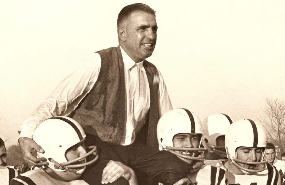 Long Branch coach Army Ippolito is carried off the field by his players after a big win in 1960.