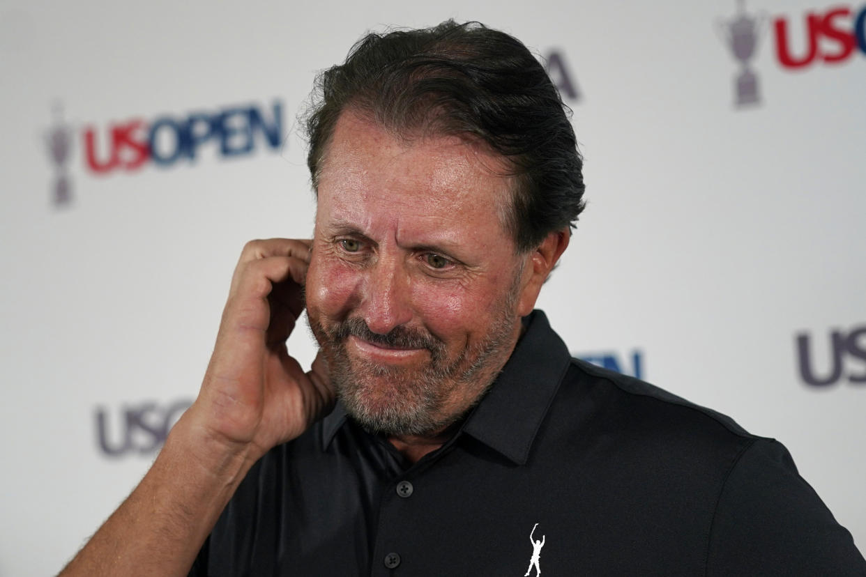 Phil Mickelson ponders a question at a press conference, Monday, June 13, 2022, at The Country Club in Brookline, Mass., ahead of the U.S. Open golf tournament. (AP Photo/Robert F. Bukaty)