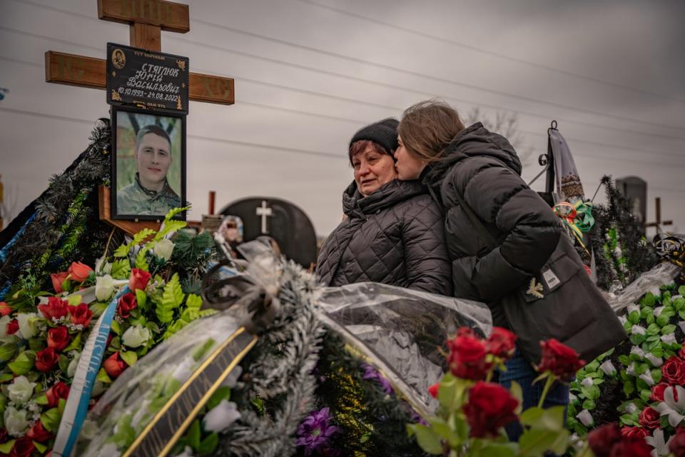 Residents of Bucha mourn their dead on the anniversary of Russia’s invasion of the country (Bel Trew)